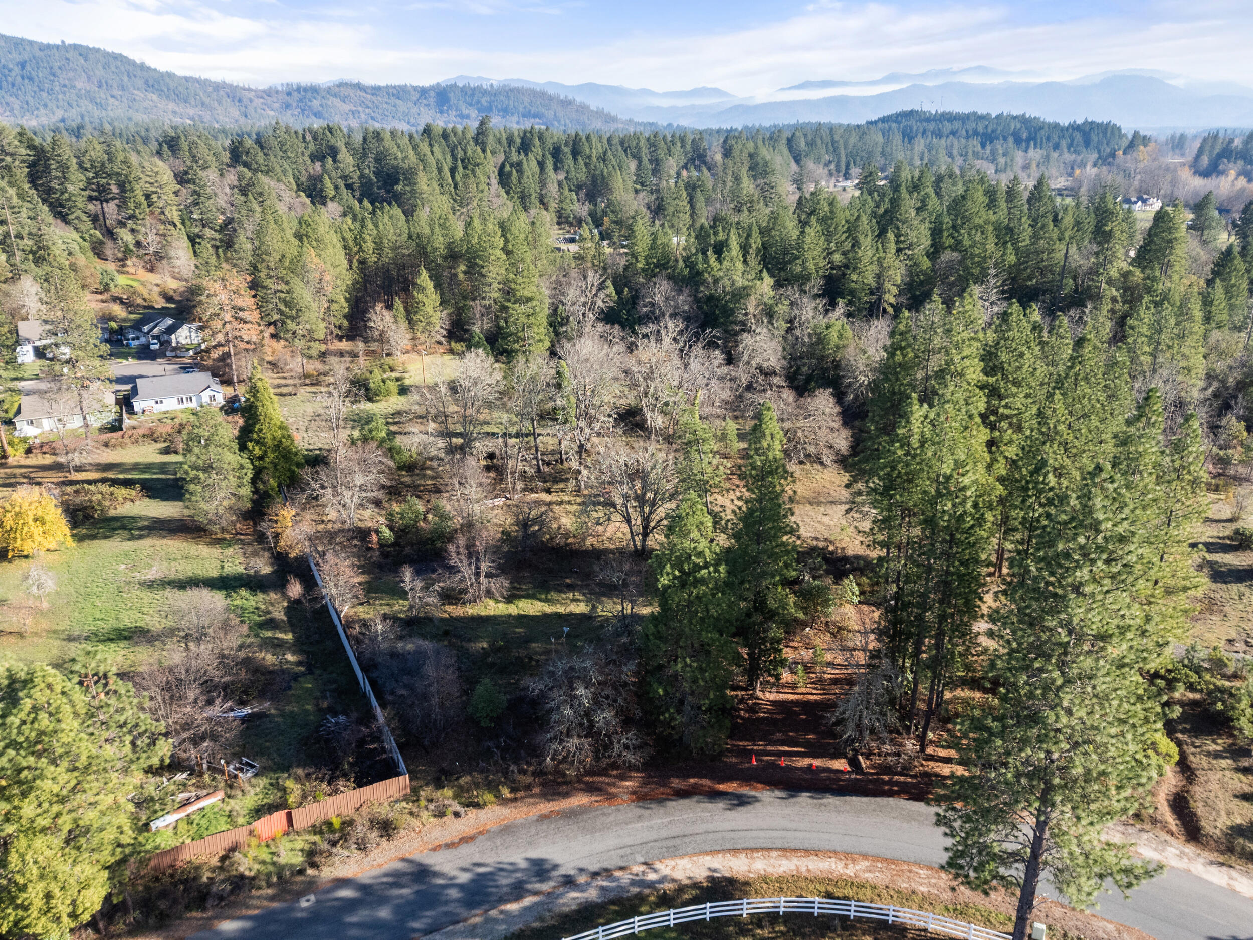 681 Daisy Hill Road Cave Junction, OR 97523 - Photo 22 of 26 a view of a town with mountains and a mountain
