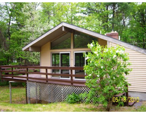 73 Dunn Road Ashburnham, MA 01430 - Photo 1 of 1 a view of a house with backyard and sitting area