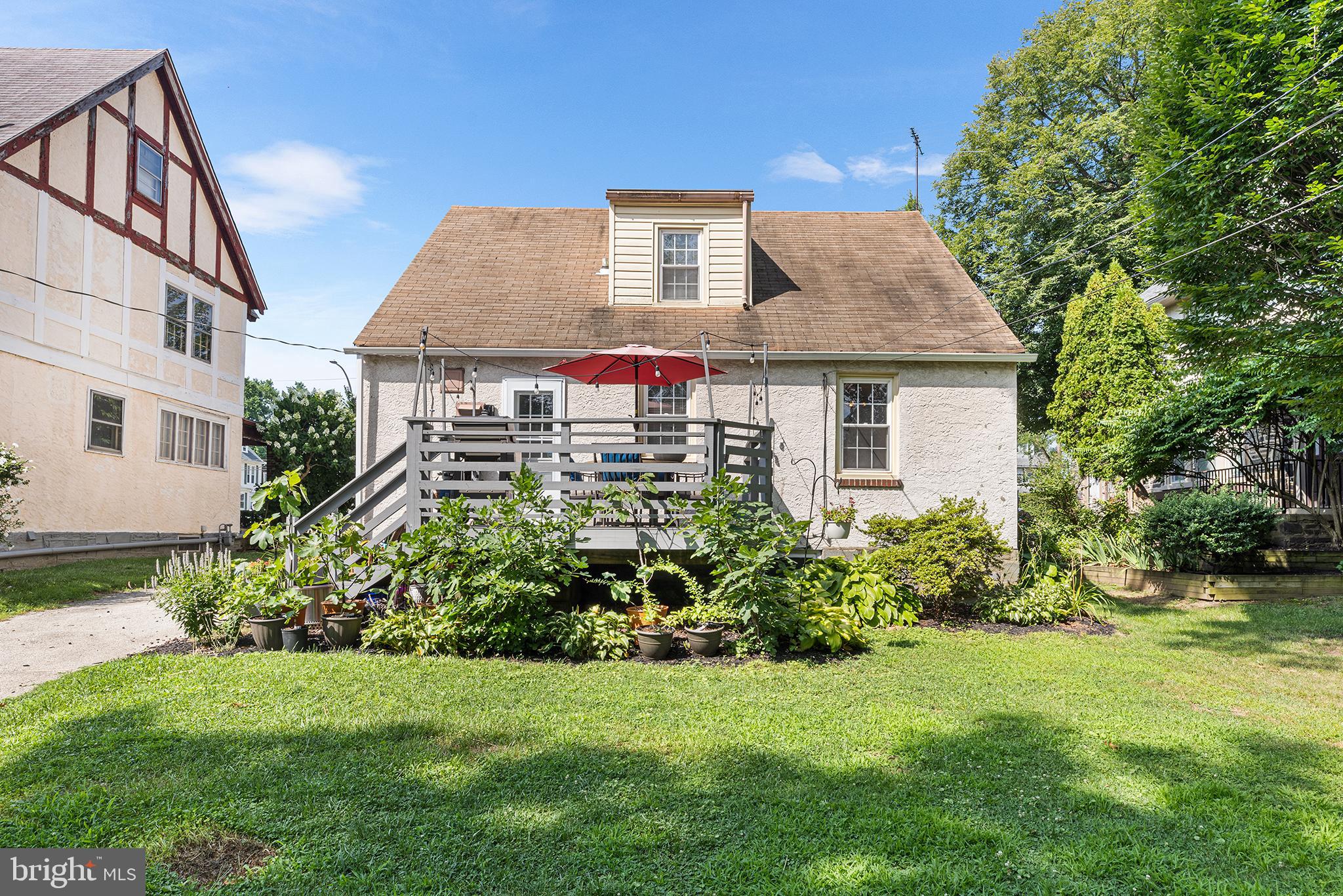 607 Darby Road Havertown, PA 19083 - Photo 23 of 26 a front view of a house with a garden