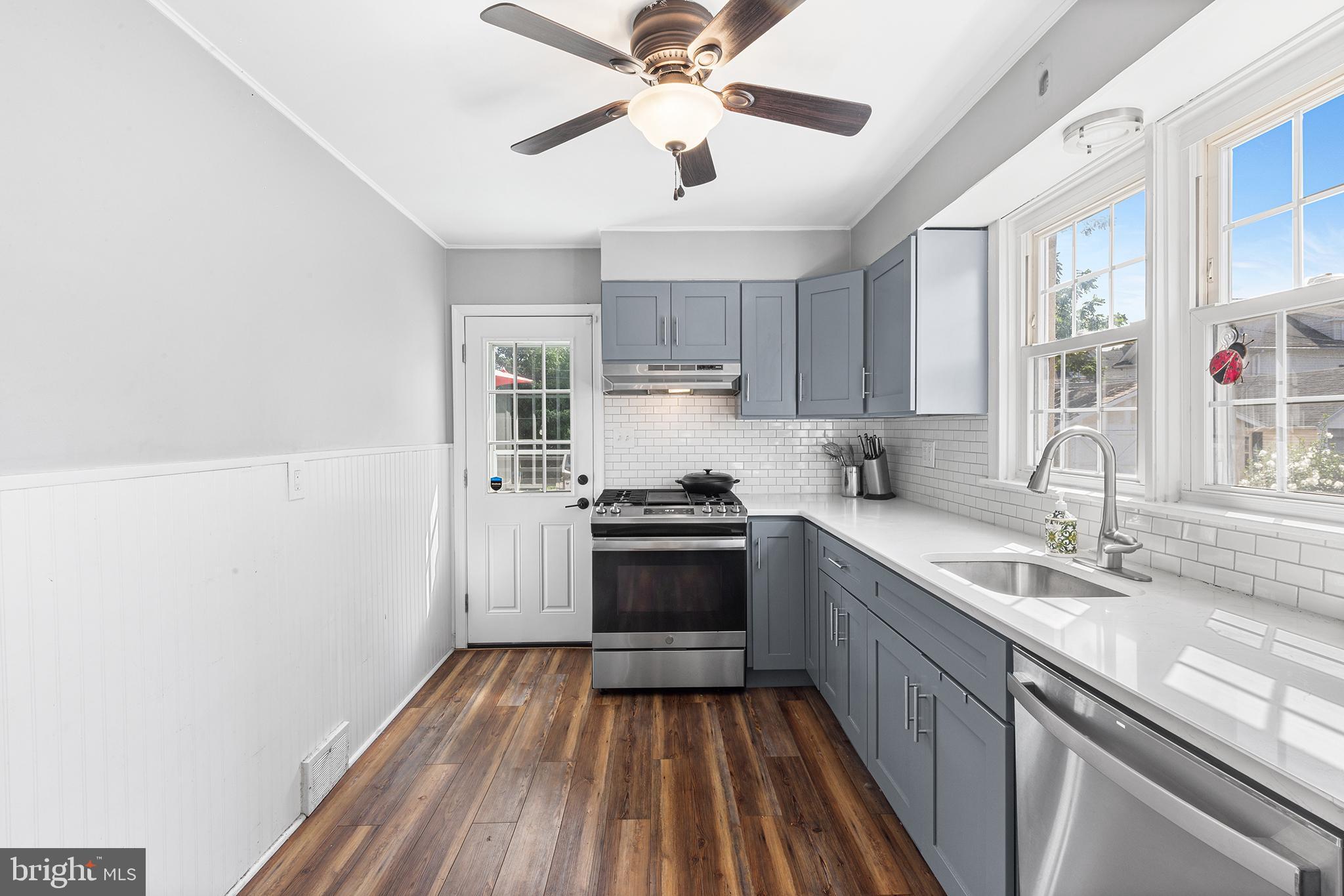 607 Darby Road Havertown, PA 19083 - Photo 9 of 26 a kitchen with a sink cabinets a window and a counter top space