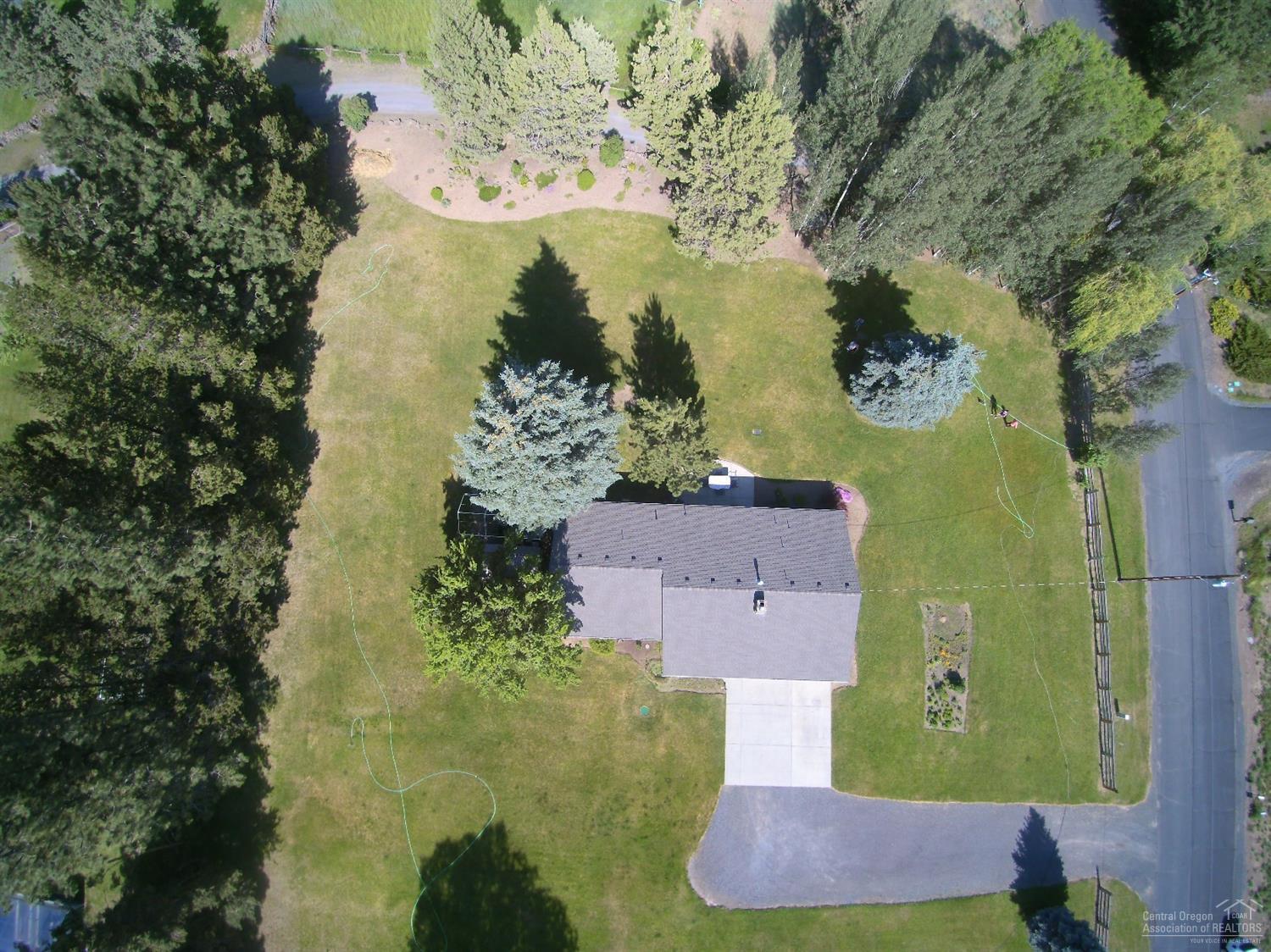 61835 Dobbin Road Bend, OR 97702 - Photo 20 of 23 an aerial view of residential houses with outdoor space