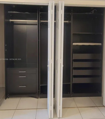a bathroom with a close shower view and a sink