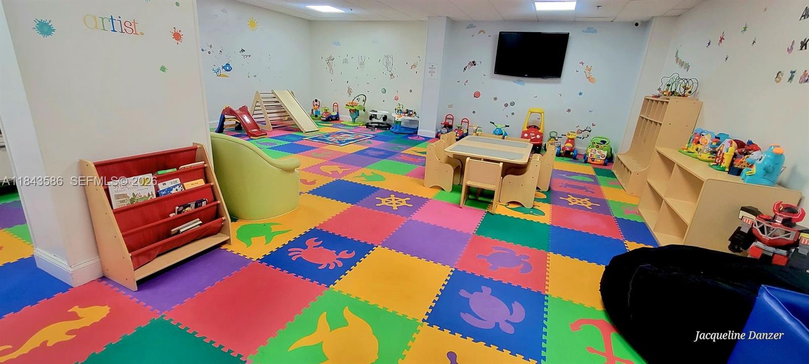 540 Brickell Key Drive, Unit 307 Miami, FL 33131 - Photo 28 of 29 a living room filled with furniture and a flat screen tv