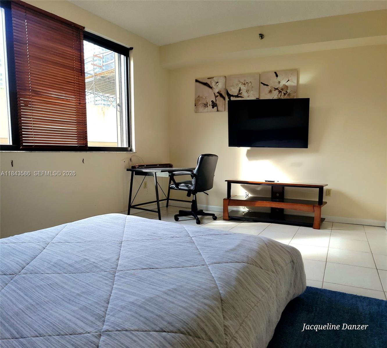 540 Brickell Key Drive, Unit 307 Miami, FL 33131 - Photo 10 of 29 a living room with furniture and a flat screen tv