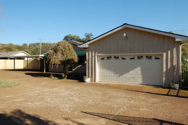 a view of a house with a snow in the background