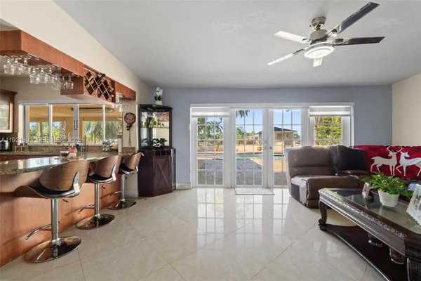a kitchen with a refrigerator and a sink