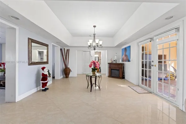 a view of a livingroom with furniture and a chandelier