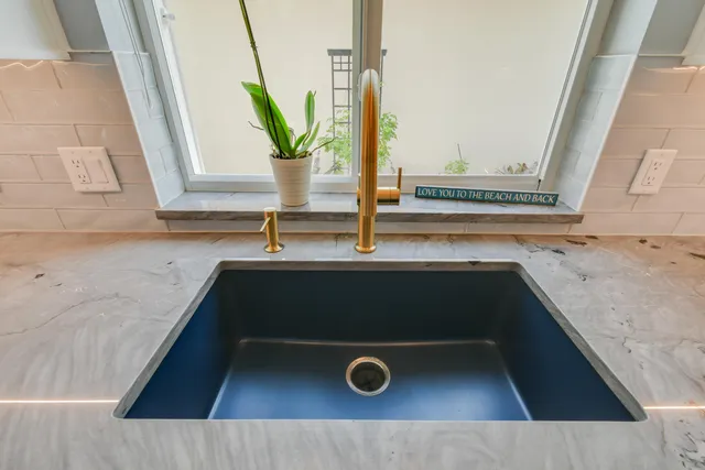 a bathroom with a double vanity sink and a mirror