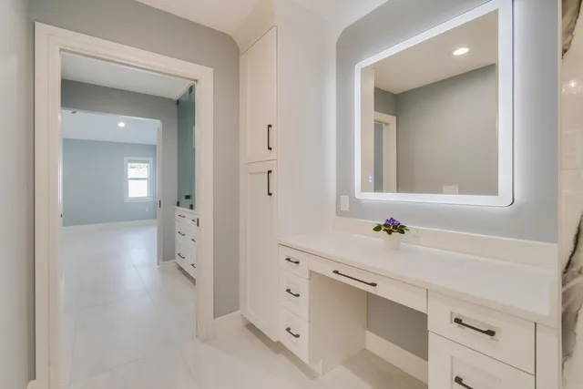 a view of a dining room with furniture large windows and wooden floor