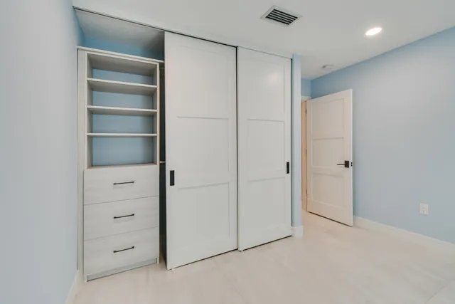 a view of a swimming pool and lounge chairs