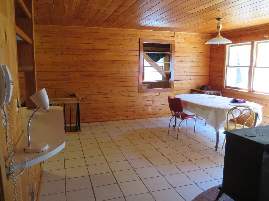 69 Pemaquid Harbor Road Pemaquid, ME 04558 - Photo 4 of 12 dining room with wood stove.