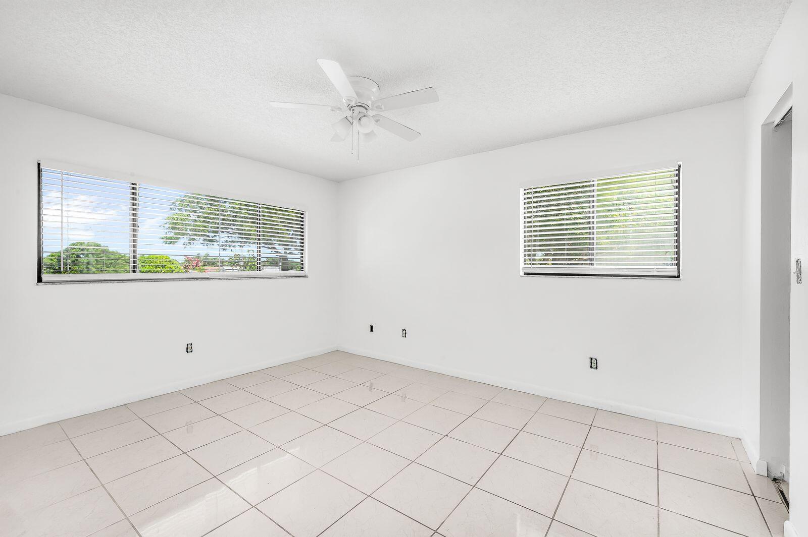 9743 West McNab Road, Unit 209 Tamarac, FL 33321 - Photo 13 of 22 a view of an empty room with a window