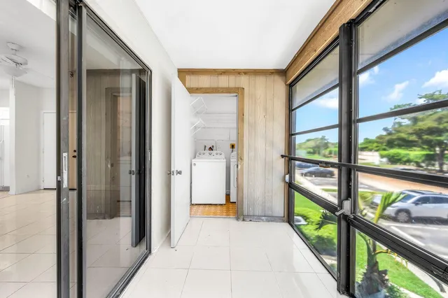 a view of a glass door with a balcony