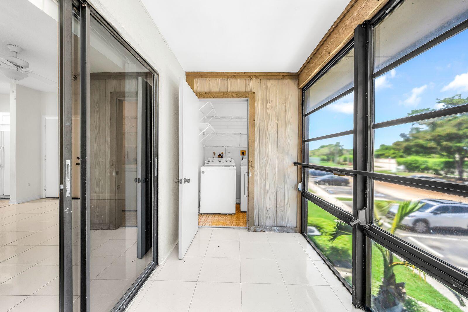 9743 West McNab Road, Unit 209 Tamarac, FL 33321 - Photo 18 of 22 a view of a glass door with a balcony