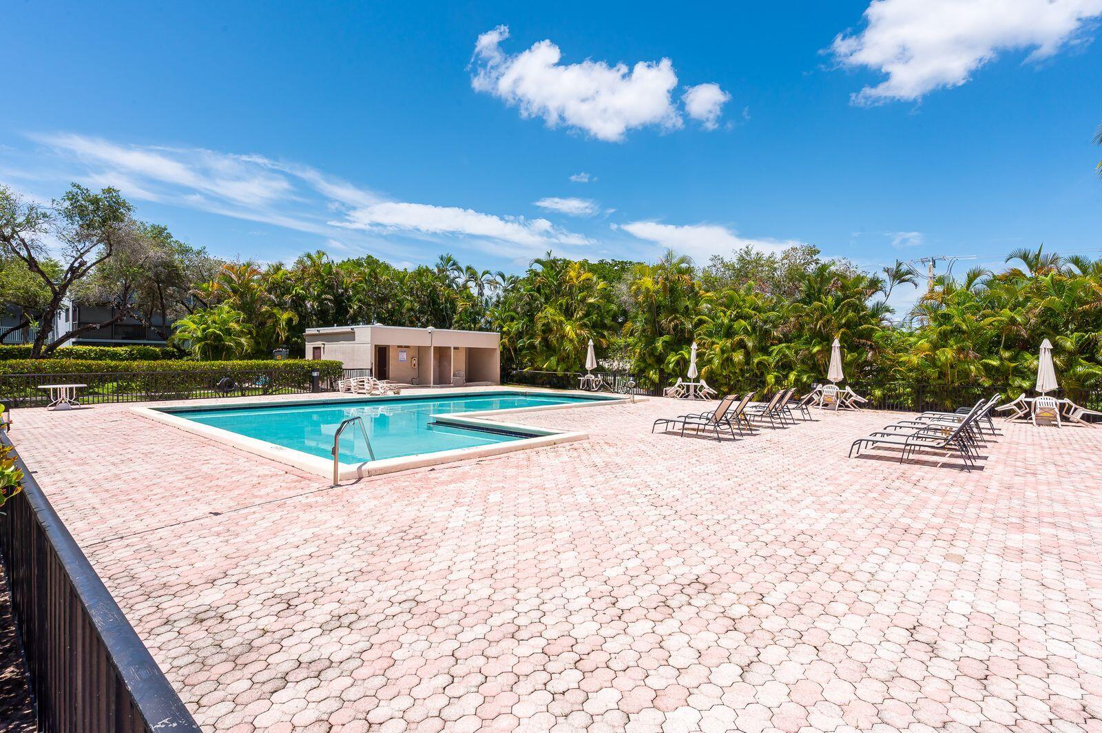 9743 West McNab Road, Unit 209 Tamarac, FL 33321 - Photo 22 of 22 a view of a backyard with swimming pool