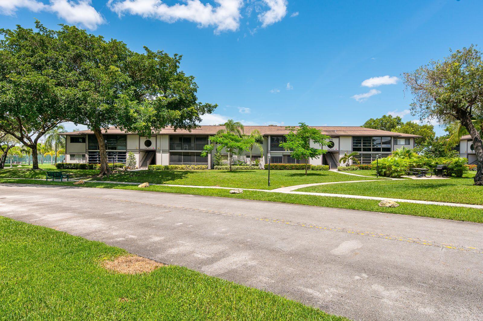 9743 West McNab Road, Unit 209 Tamarac, FL 33321 - Photo 3 of 22 a view of a volley ball court