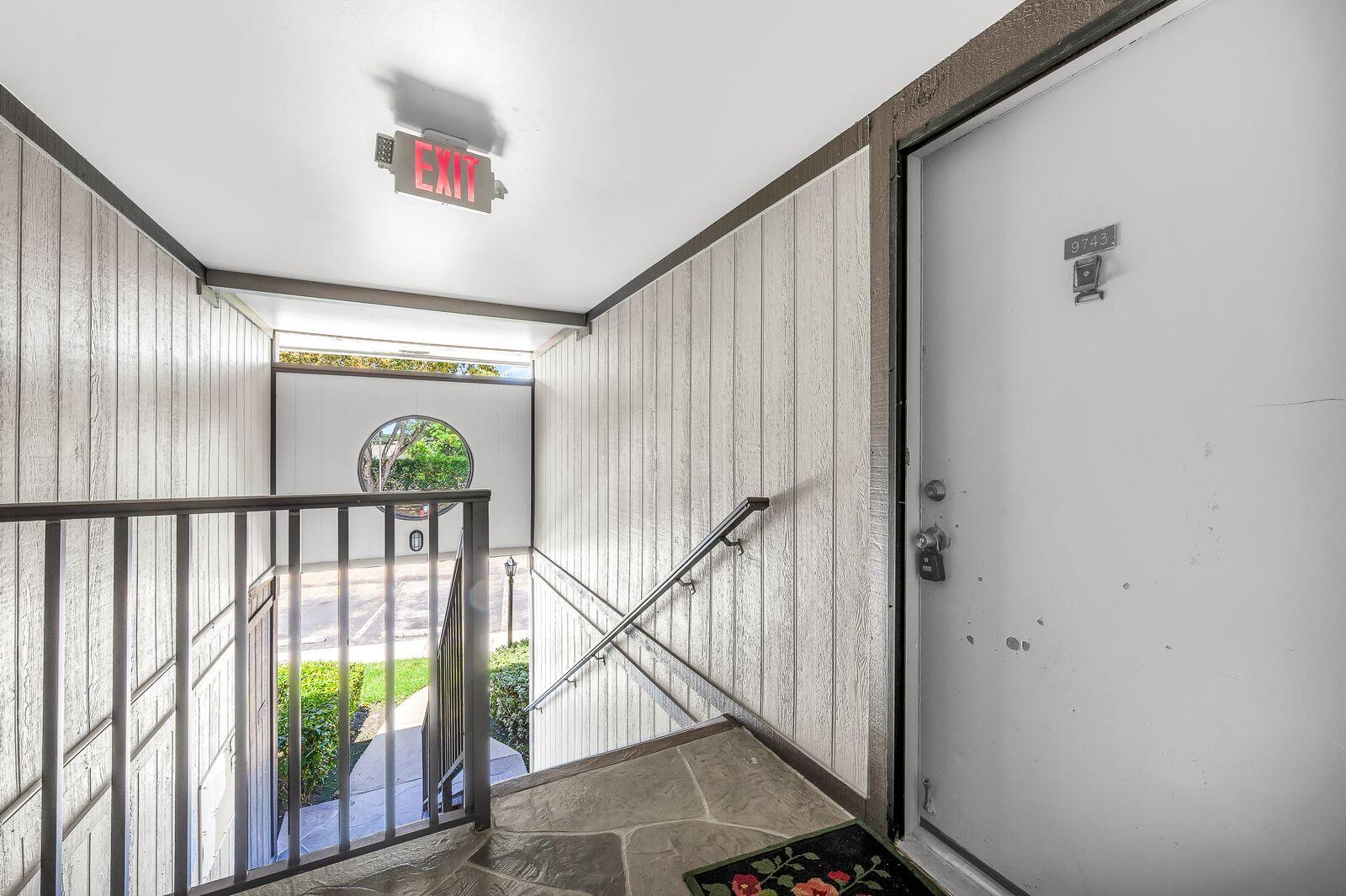 9743 West McNab Road, Unit 209 Tamarac, FL 33321 - Photo 4 of 22 a view of entryway with wooden floor