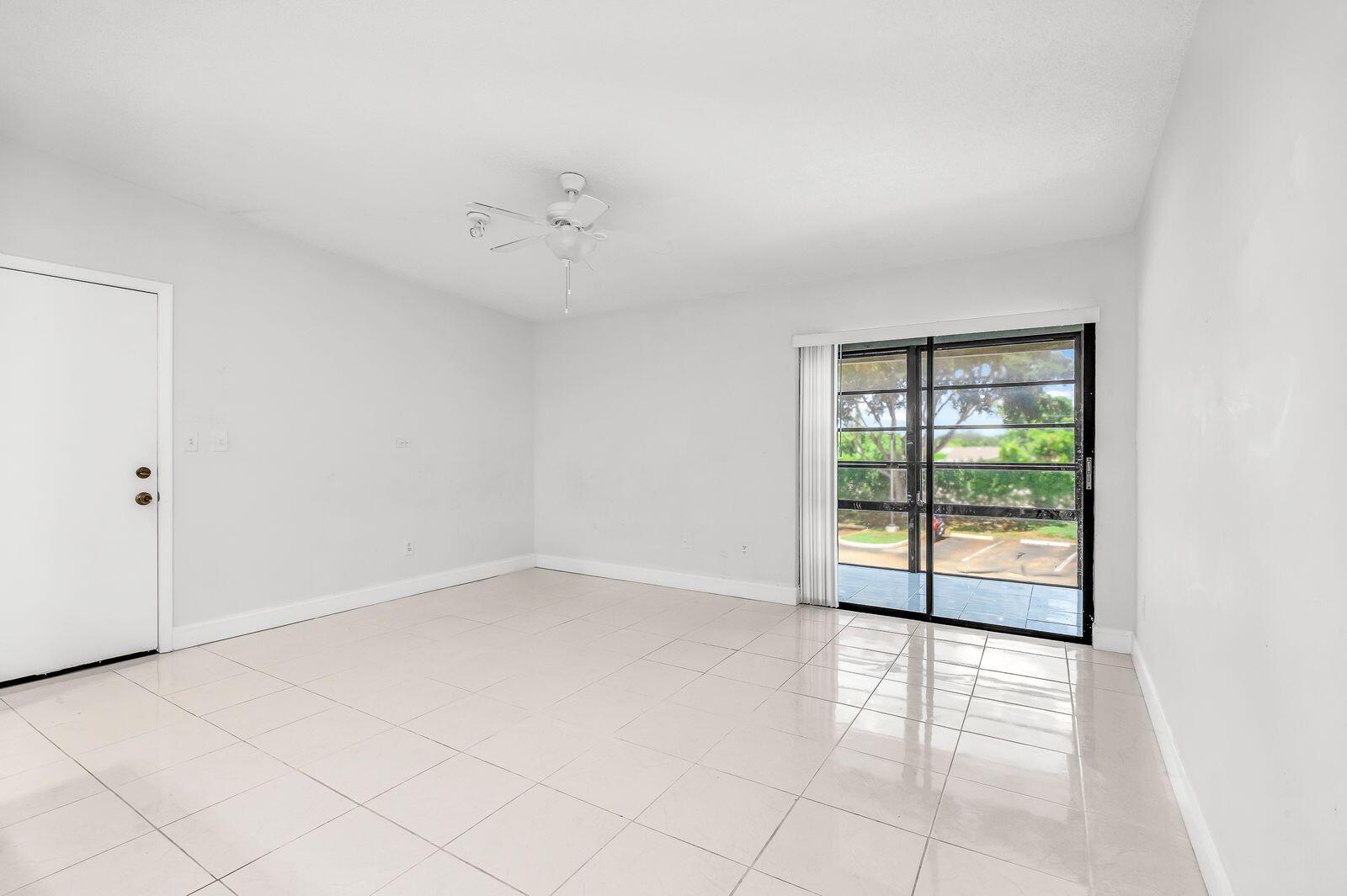 9743 West McNab Road, Unit 209 Tamarac, FL 33321 - Photo 10 of 22 an empty room with windows