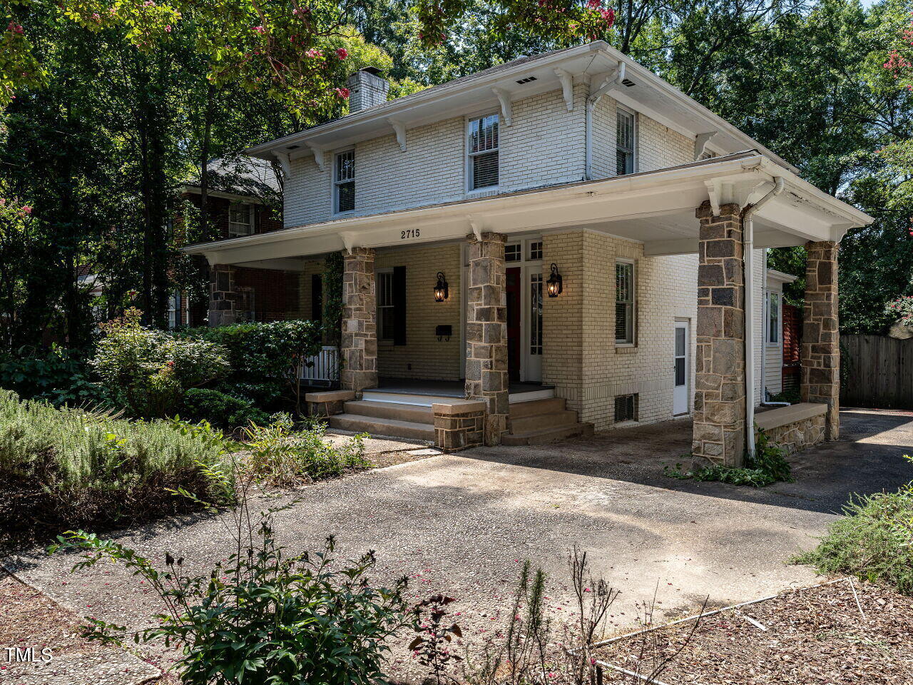 2715 Vanderbilt Avenue Raleigh, NC 27607 - Photo 2 of 36 a front view of a house with garden