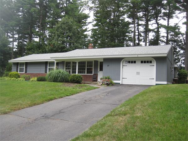 23 Porter Road Chelmsford, MA 01824 - Photo 1 of 21 a view of a house with a yard and large tree