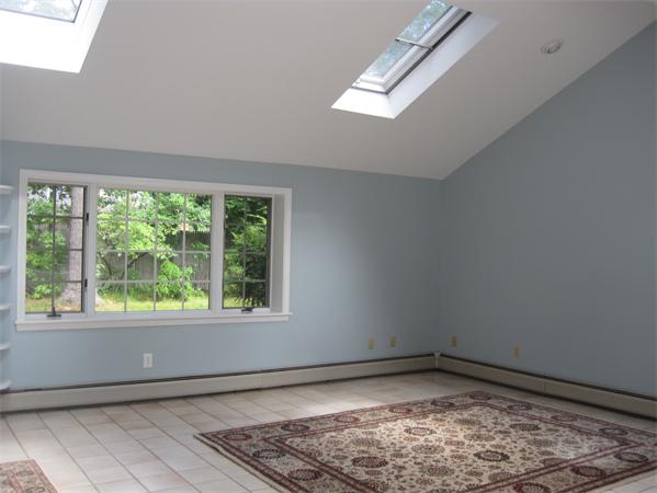 23 Porter Road Chelmsford, MA 01824 - Photo 12 of 21 a view of empty room with wooden floor and fan