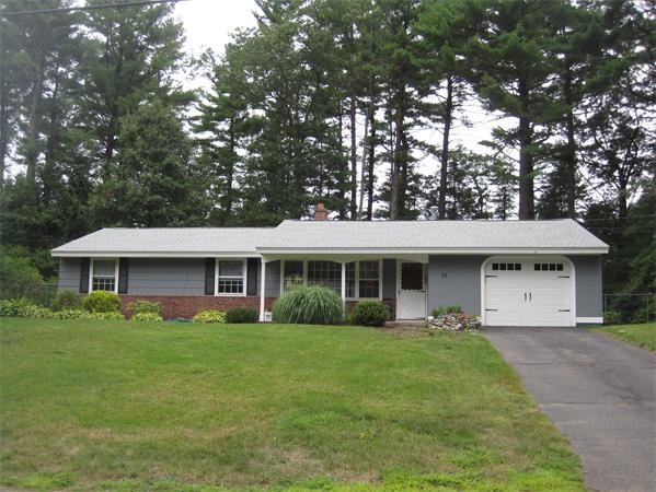 23 Porter Road Chelmsford, MA 01824 - Photo 19 of 21 a front view of house with yard and green space