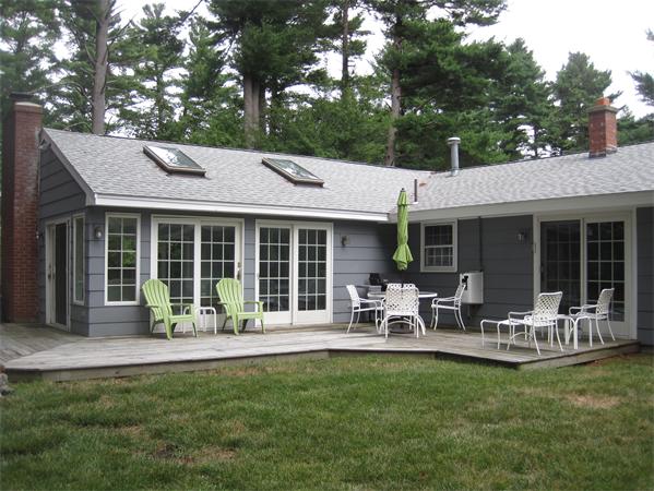 23 Porter Road Chelmsford, MA 01824 - Photo 20 of 21 a front view of house with a garden and patio