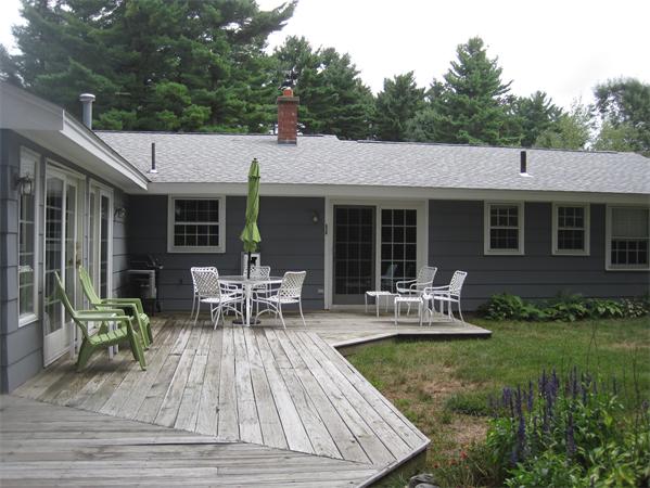 23 Porter Road Chelmsford, MA 01824 - Photo 2 of 21 a view of a house with backyard sitting area and garden