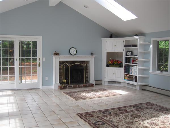 23 Porter Road Chelmsford, MA 01824 - Photo 3 of 21 a view of a livingroom with an empty space and fire place