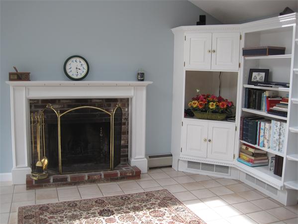23 Porter Road Chelmsford, MA 01824 - Photo 4 of 21 a view of living room with furniture and fireplace