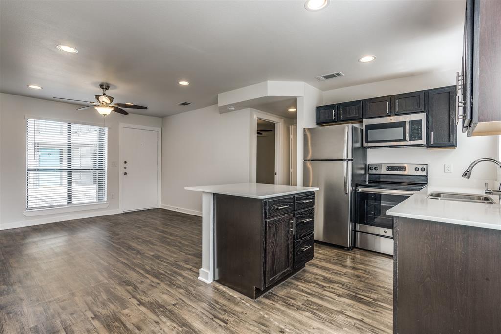 2106 Bennett Avenue, Unit 209 Dallas, TX 75206 - Photo 14 of 22 Open-concept living space featuring wood-finish flooring, recessed lighting, and a ceiling fan