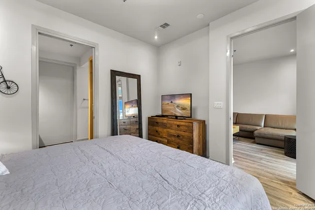 a bedroom with a bed and furniture