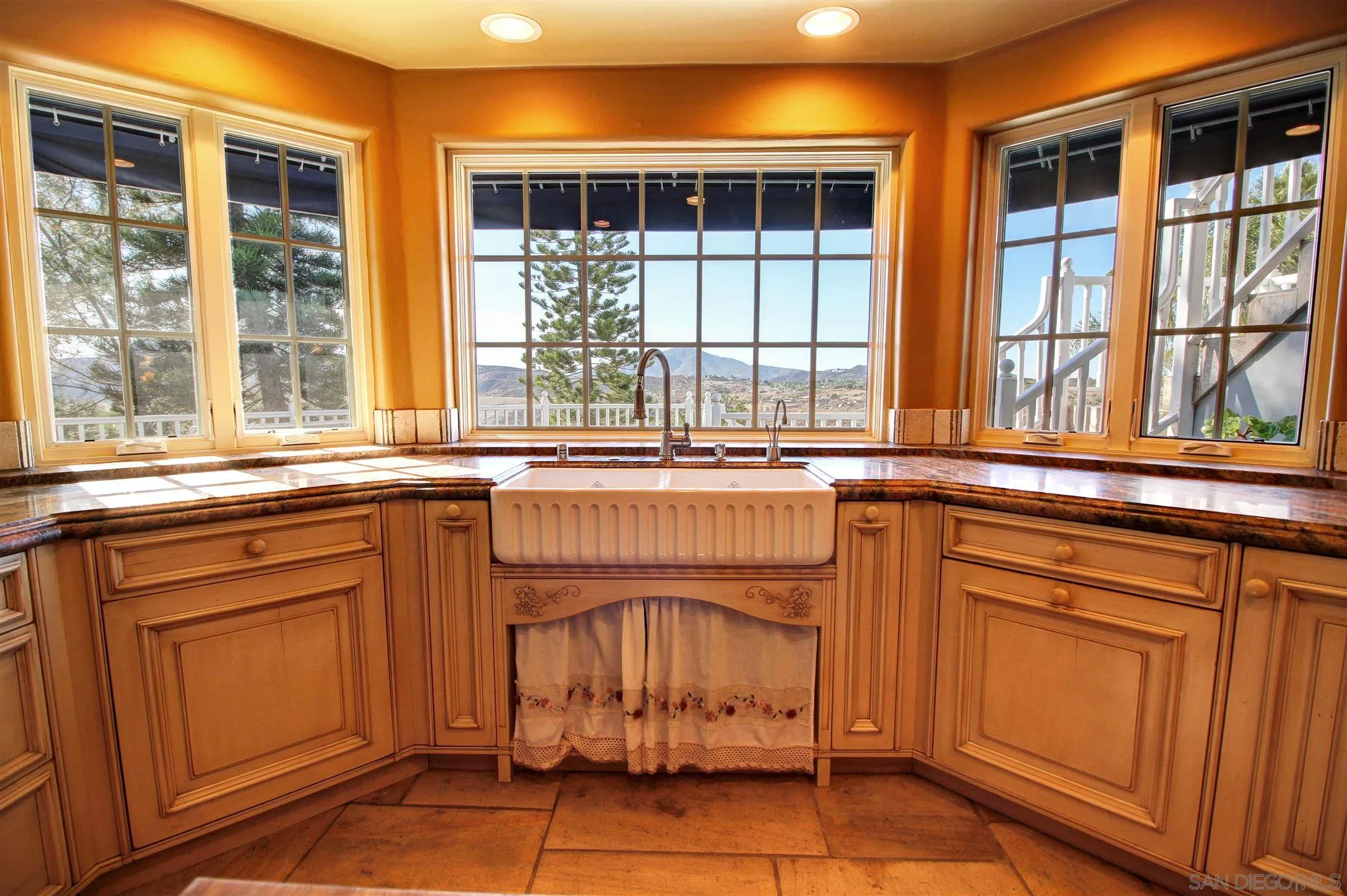 15245 Presilla Drive Jamul, CA 91935 - Photo 16 of 57 a kitchen with stainless steel appliances granite countertop a stove and a sink