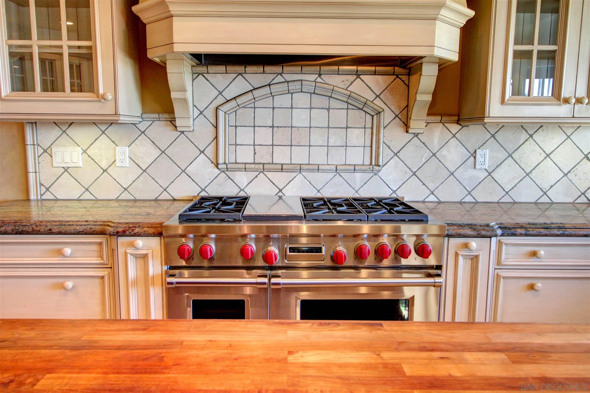 15245 Presilla Drive Jamul, CA 91935 - Photo 17 of 57 a kitchen with stainless steel appliances granite countertop a stove and a refrigerator