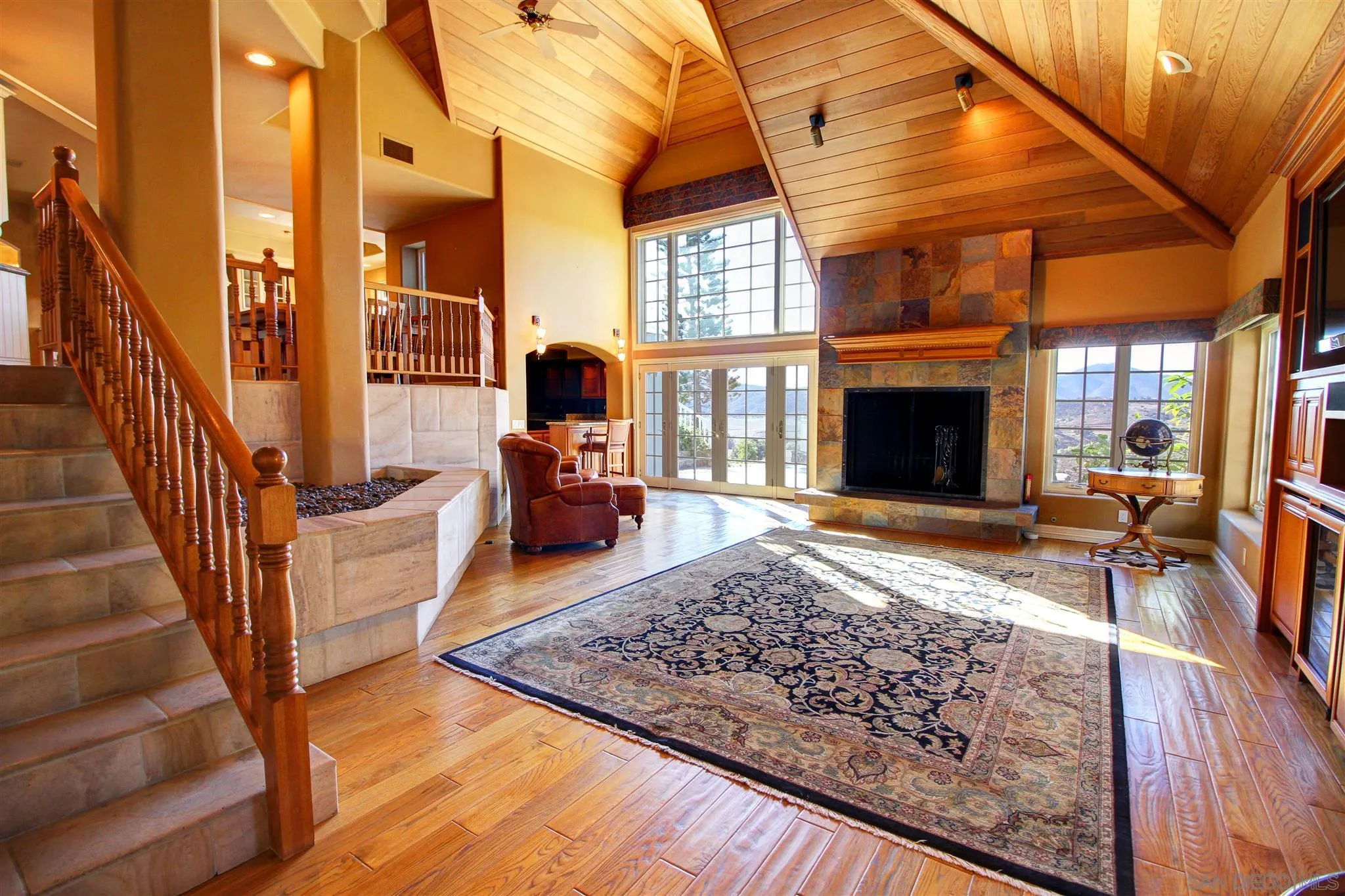 15245 Presilla Drive Jamul, CA 91935 - Photo 19 of 57 a view of a livingroom with wooden floor and a fireplace