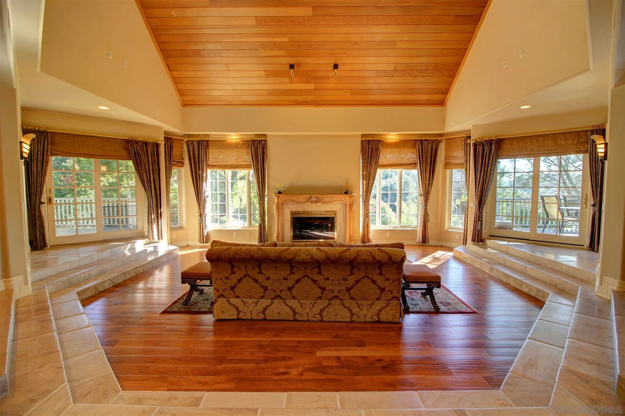 15245 Presilla Drive Jamul, CA 91935 - Photo 23 of 57 a living room with furniture large windows and wooden floor