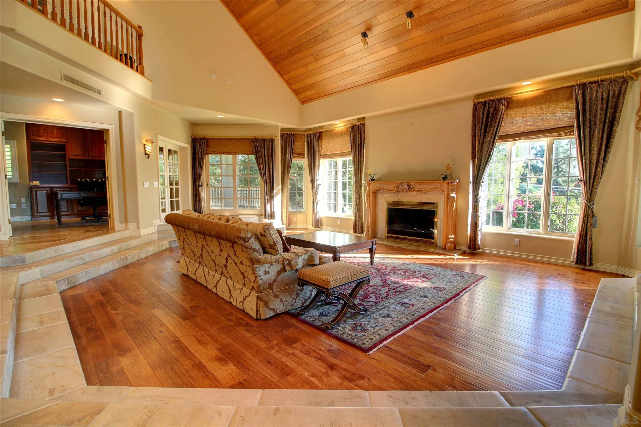 15245 Presilla Drive Jamul, CA 91935 - Photo 24 of 57 a living room with furniture large window and wooden floor