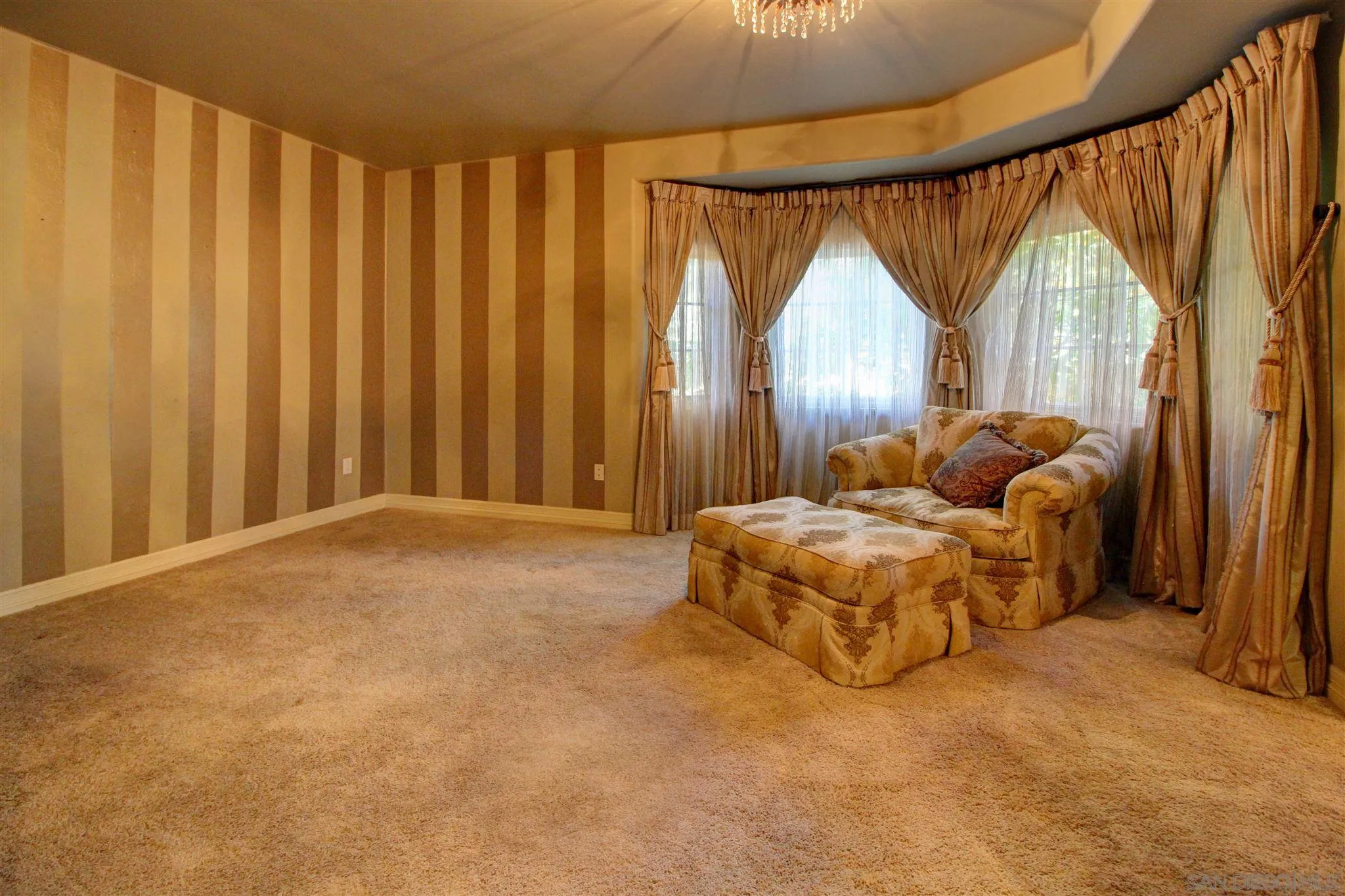 15245 Presilla Drive Jamul, CA 91935 - Photo 26 of 57 a bed sitting in a spacious bedroom next to a window