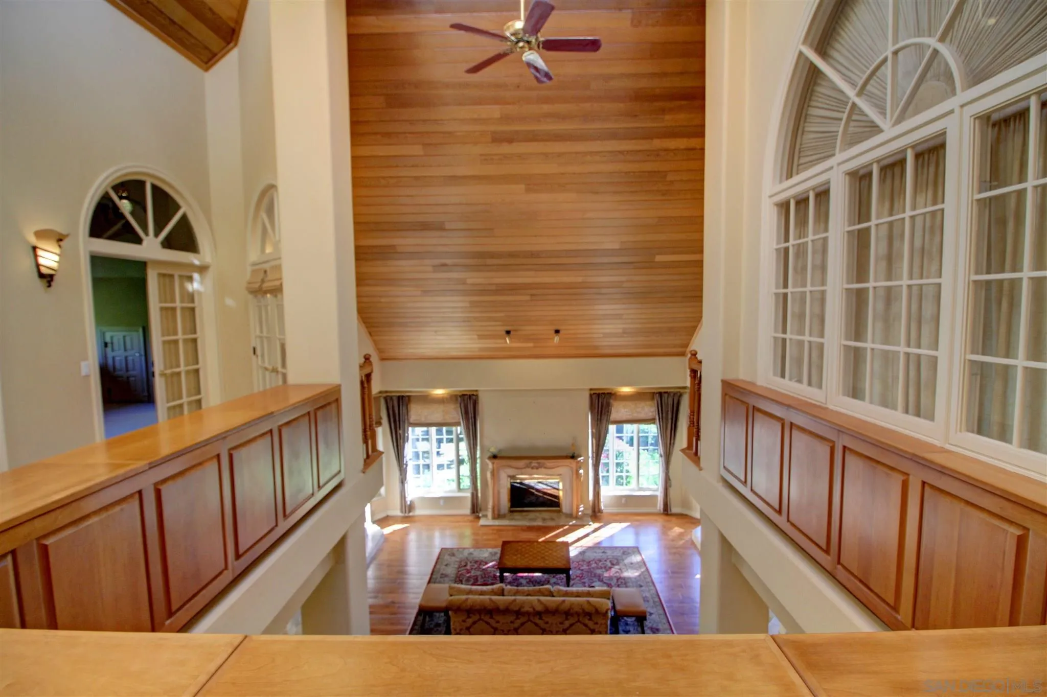 15245 Presilla Drive Jamul, CA 91935 - Photo 31 of 57 a view of living room with wooden floor and a fireplace