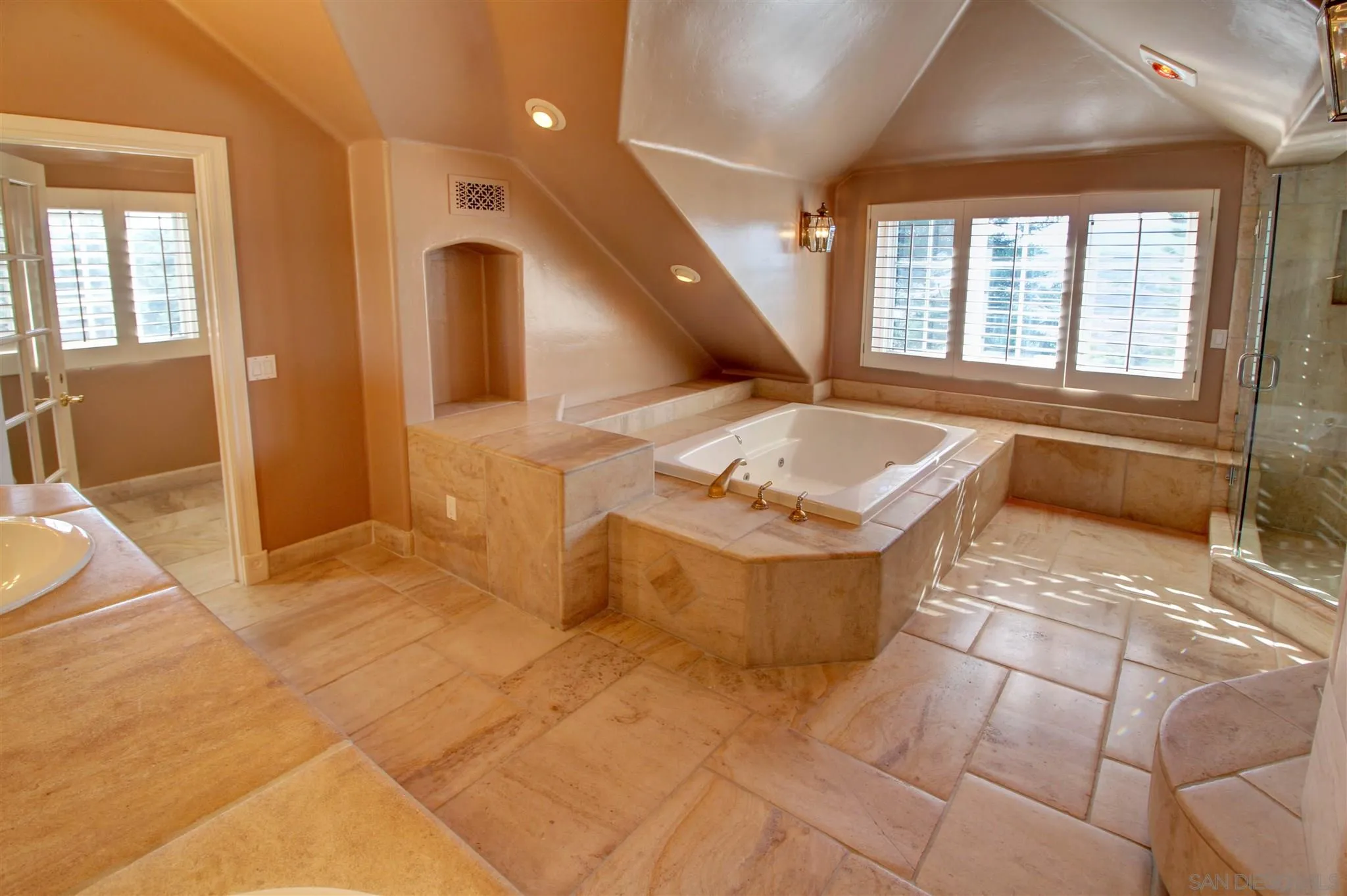 15245 Presilla Drive Jamul, CA 91935 - Photo 35 of 57 a spacious bathroom with a tub sink and mirror
