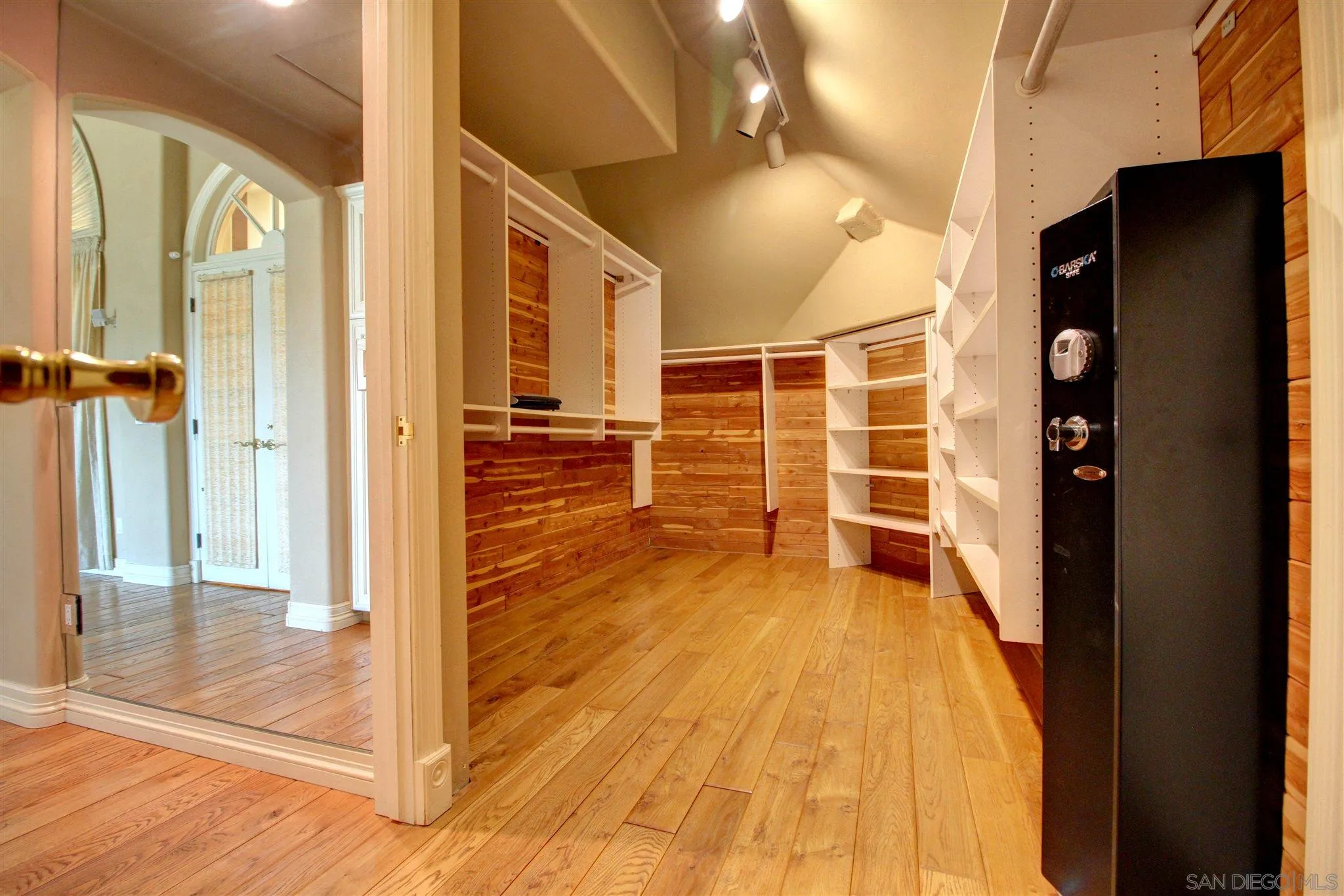 15245 Presilla Drive Jamul, CA 91935 - Photo 38 of 57 a view of a bathroom with wooden floor and a glass door