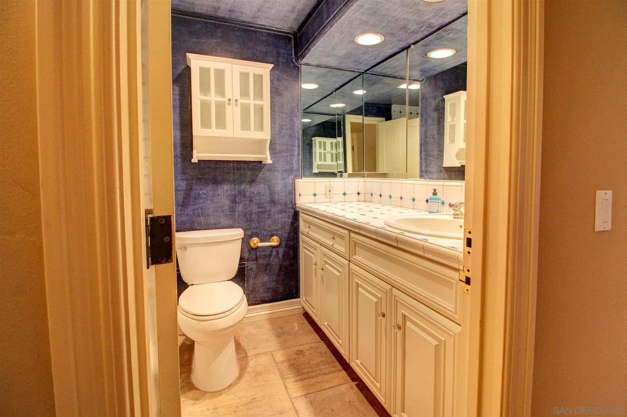 15245 Presilla Drive Jamul, CA 91935 - Photo 43 of 57 a bathroom with a toilet sink and mirror