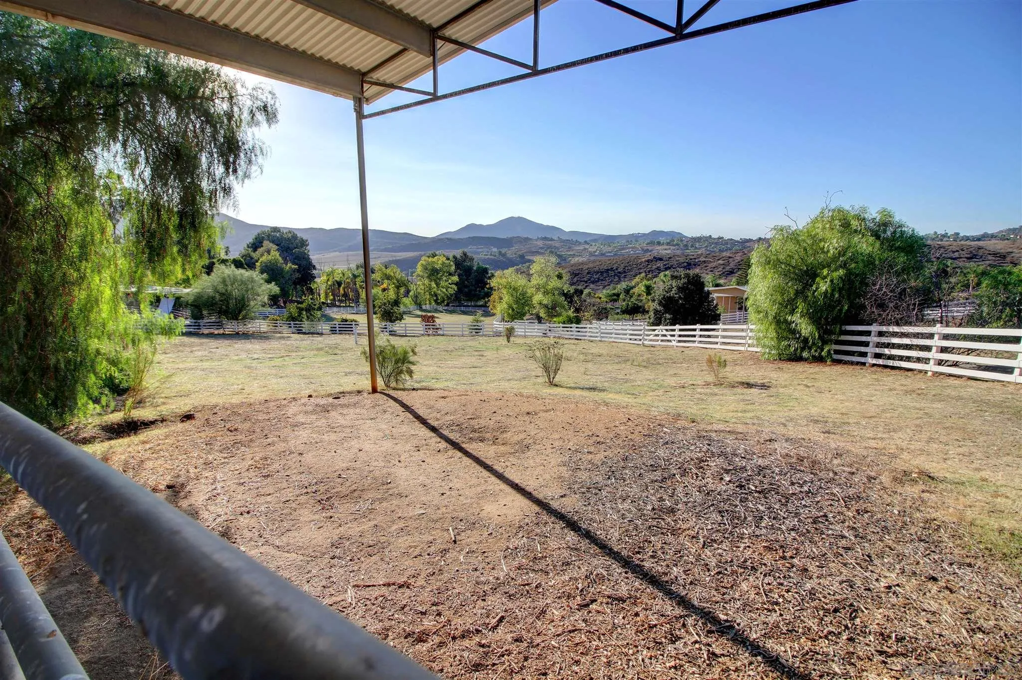 15245 Presilla Drive Jamul, CA 91935 - Photo 51 of 57 a view of a road with a bench in the background
