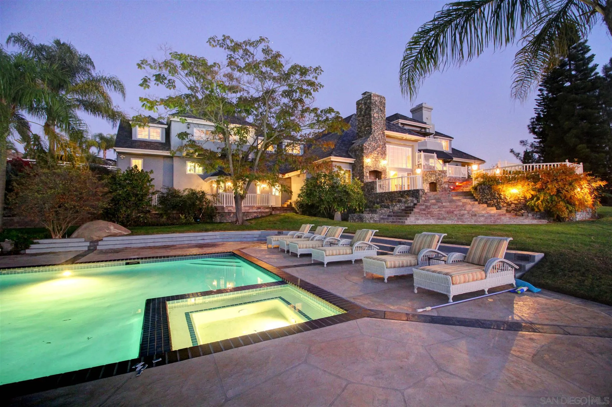 15245 Presilla Drive Jamul, CA 91935 - Photo 56 of 57 a view of a swimming pool with lawn chairs under an umbrella