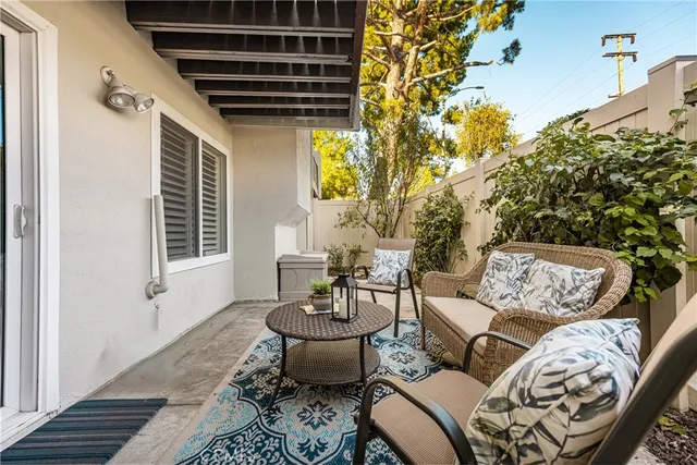 a outdoor living space with furniture and a potted plant