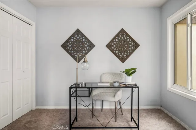 a view of a workspace with furniture