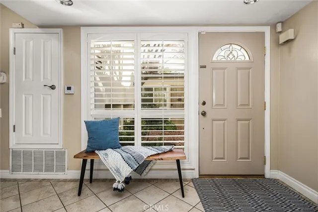 a view of a livingroom with furniture and a window