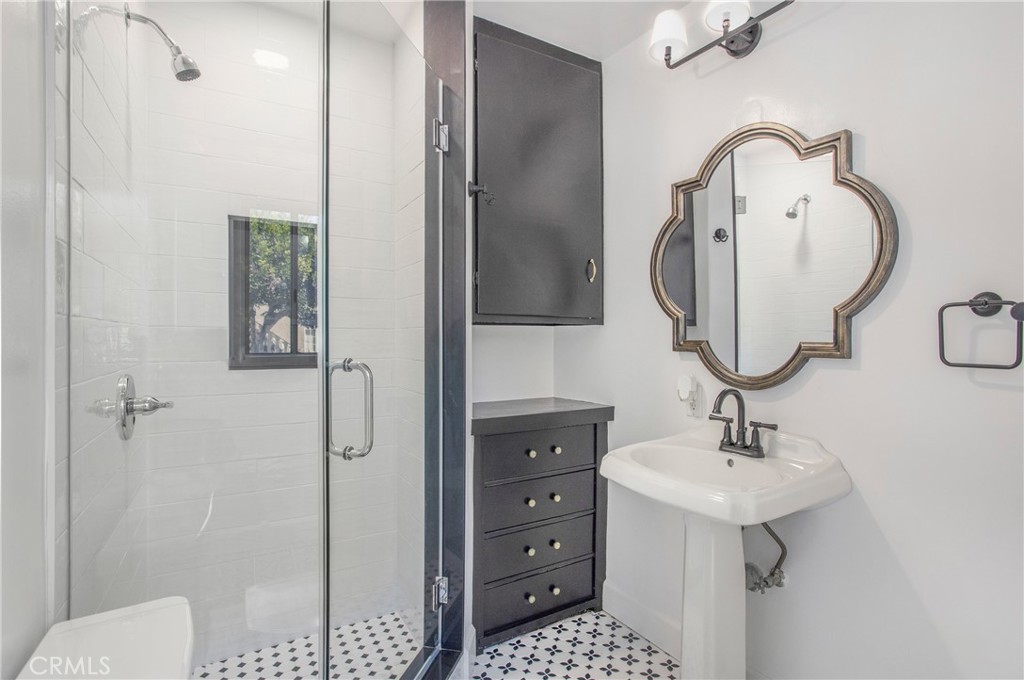 134 Prospect Avenue Long Beach, CA 90803 - Photo 13 of 21 a bathroom with a sink a toilet and shower