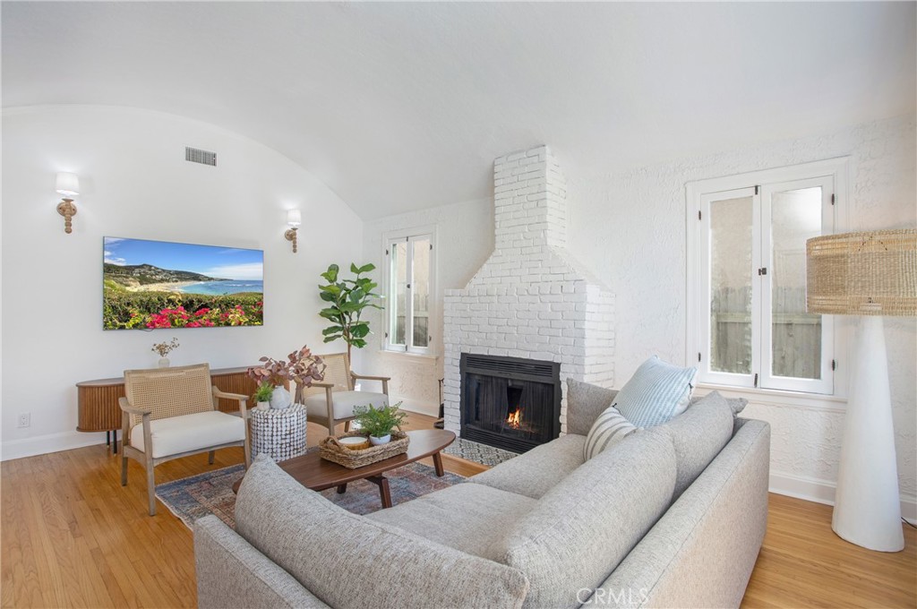 134 Prospect Avenue Long Beach, CA 90803 - Photo 3 of 21 a living room with furniture and a fireplace