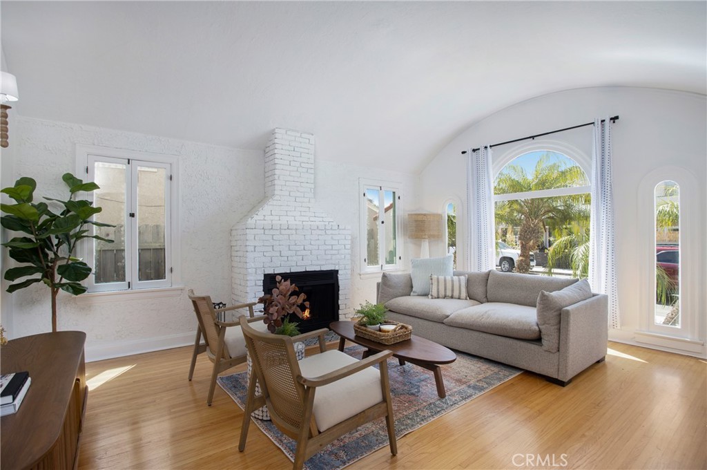 134 Prospect Avenue Long Beach, CA 90803 - Photo 4 of 21 a living room with furniture fireplace and a large window